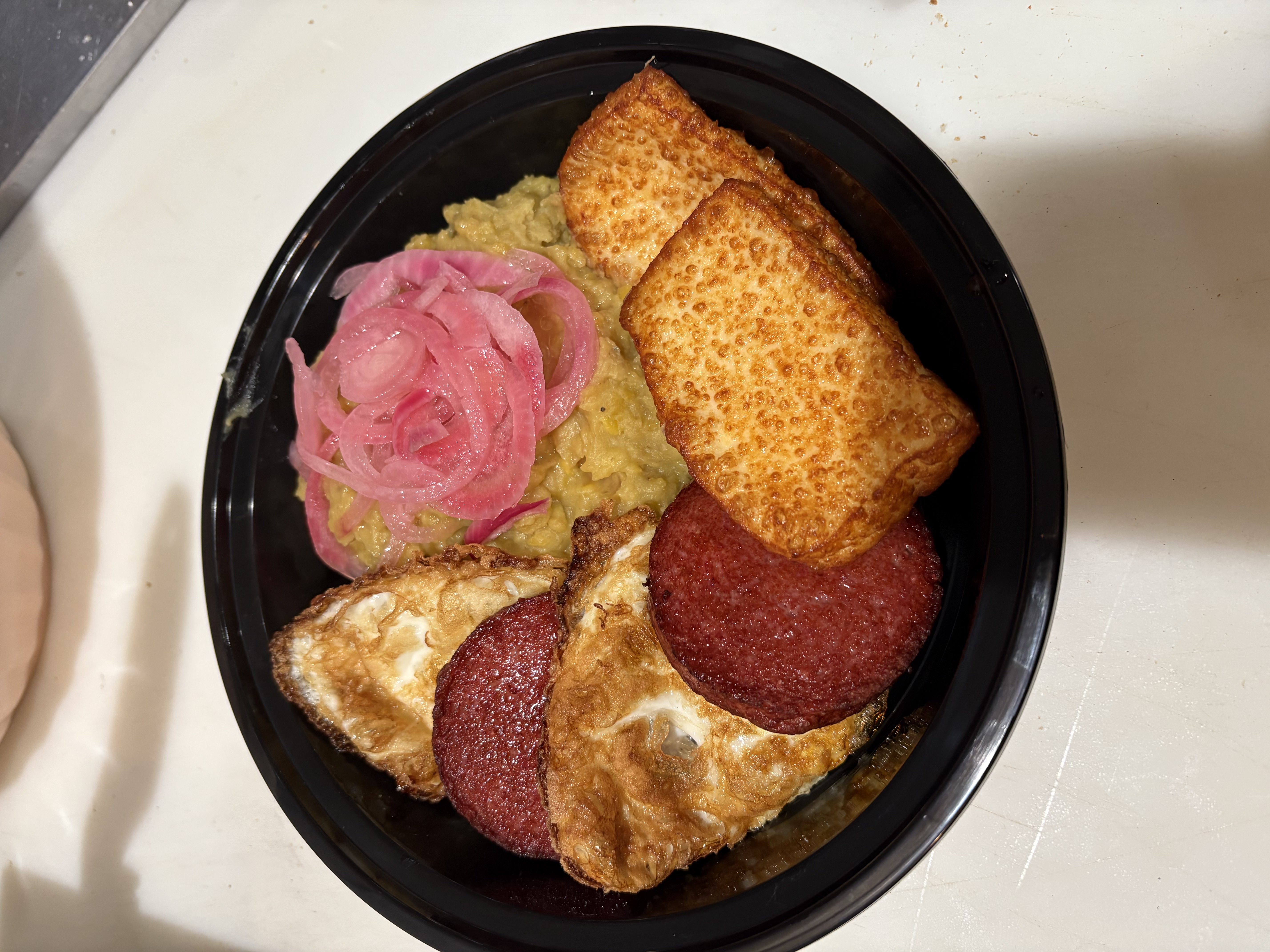 Close-up of a Barbara's Cafe meal with Dominican-inspired flavor