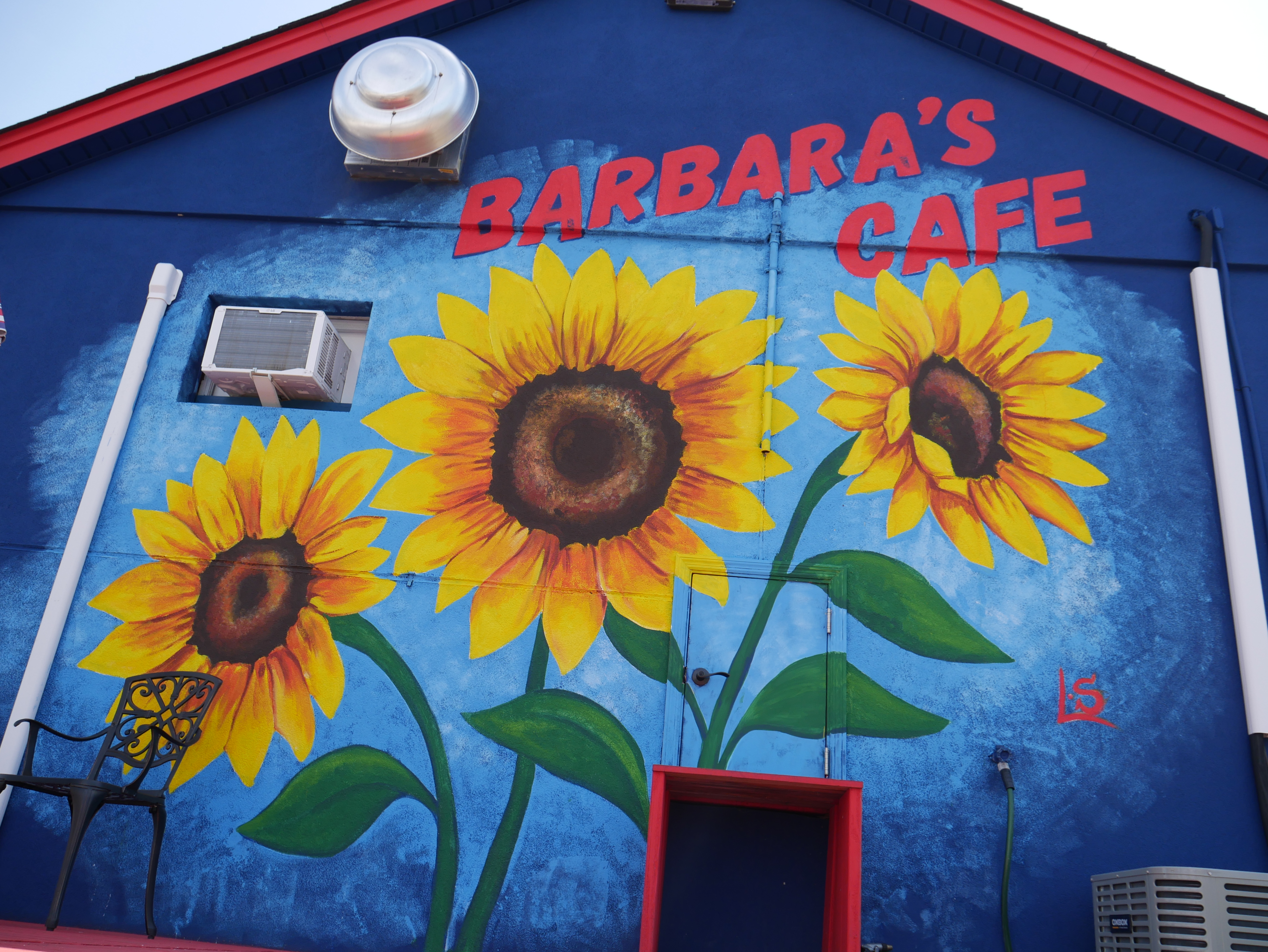 Barbara's Cafe mural wall with sunflowers